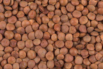 Picture of brown lentils over flat surface