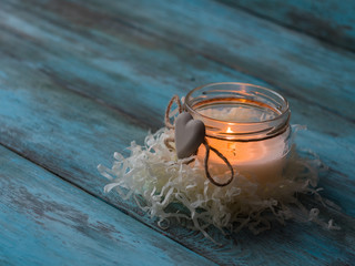 Obraz na płótnie Canvas Composition of spa treatment candle on wooden background. Copy space