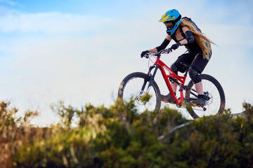 Fototapeta na wymiar Woman riding MTB mountain biking, cross-country