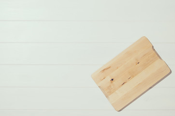 Product photo of white, painted, wooden table. Visible texture background. Studio image taken from above, top view.