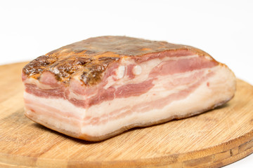 Board of raw pork meaty bacon on the wooden board