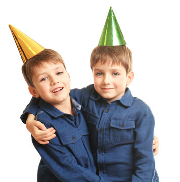 Cute Twins With Birthday Hats On White Background