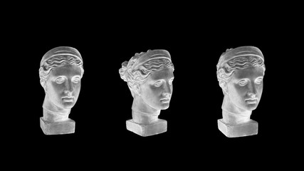 Marble head of young woman, ancient Greek goddess bust isolated on black background.