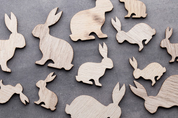 Obraz na płótnie Canvas Handmade wood easter rabbits on wooden background.