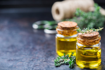 Organic essential thyme oil with green leaves