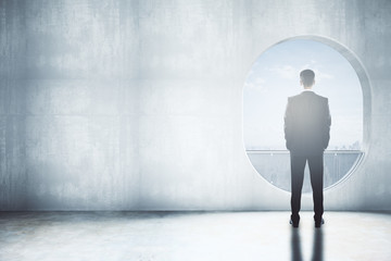 Obraz premium Thoughtful man in concrete interior