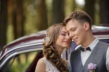 Wedding portrait of beautiful and young bride and groom at wedding day