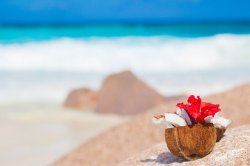 Fototapeta na wymiar picture of fresh coconut juice on tropical beach. La Digue island, Seychelles