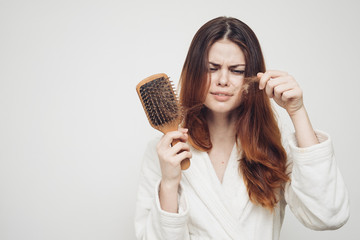woman combs red hair, scalp care, massage
