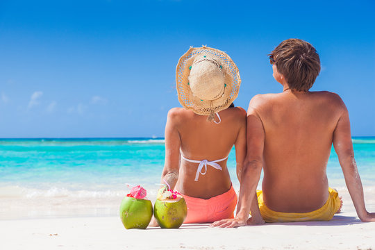 picture of fresh coconut juice and sunglasses on tropical beach