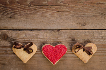  cookies-hearts  on  wooden table