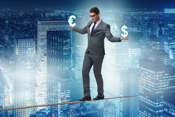 Businessman balancing between choosing dollar and euro