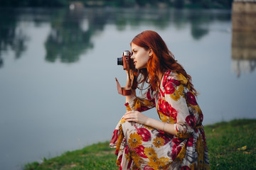 woman in a dress photography environment, river, camera, photographer