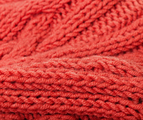 Background of red knitted fabric.