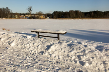 bench covered with snow