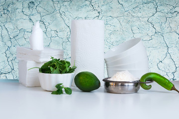 Cooking concept, kitchen interior - mushrooms. salad, green herbs, avocado, bowl of flour, green...