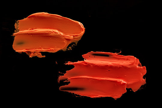 Orange Lipstick On A Black Background