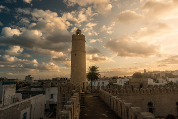 View from the walls of the fortress of Ribat of Sousse in Tunisia. Medieval architecture in sunset light.