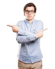 Doubtful young man pointing