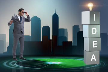 Businessman looking for bright ideas