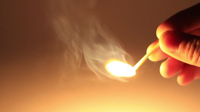 Man lights a match in darkness. How to Strike a Match. Slow Motion, HD 1080