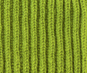 Knitted natural wool texture background. Knitted scarf element