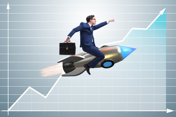 Businessman flying on rocket in business concept