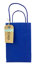 Father's Day DAD tag attached to blue gift bag. Isolated.