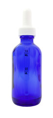 Blue medicine bottle with capped eyedropper.  Isolated.