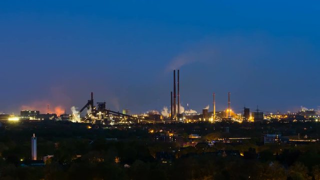 Timelapse sequence of a large coking and steel plant in Duisburg, Germany in the night in 4K with tapping and coke quenching in between.