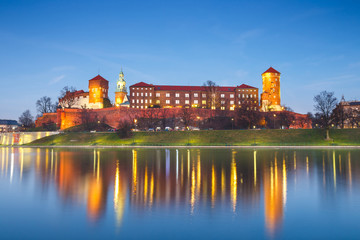 Wawel Castle in the evening in Krakow with reflection in the river, Poland. Long time exposure