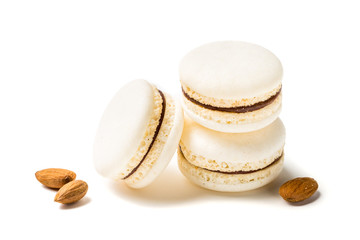 Closeup of tasty macaroons with almond on white background