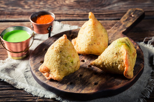 Indian samosa with vegetables and green dip