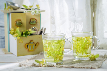 Healing linden tea with honey in spring day