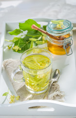 Sweet linden tea with honey in spring day