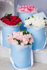 Bouquet of flowers in the boxes. 