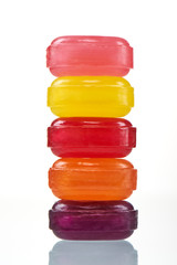 Stack colorful hard lollipop candies closeup