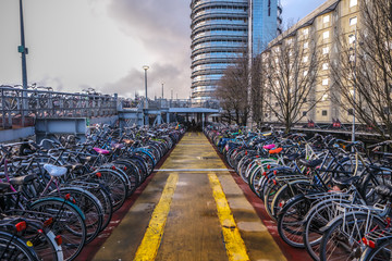 AMSTERDAM, NETHERLANDS - JANUARY 10, 2017: Three-level parking of bicycles in Amsterdam city centre. January 10, 2017 in Amsterdam - Netherlands. © Unique Vision