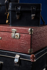 Close-up of a stack vintage shabby suitcases