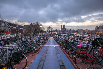 AMSTERDAM, NETHERLANDS - JANUARY 10, 2017: Three-level parking of bicycles in Amsterdam city centre. January 10, 2017 in Amsterdam - Netherlands. © Unique Vision