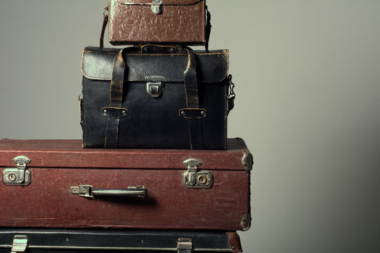 Background stack of old suitcases form a tower
