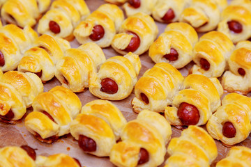 Home made pigs in a blanket. Sausages rolled in croissant dough