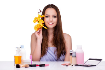 Young woman with orchid flower isolated on white