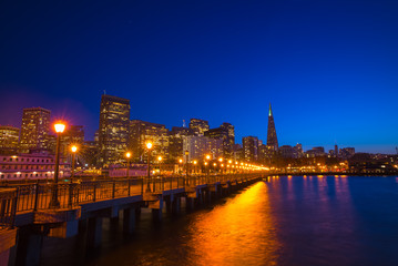 Fototapeta na wymiar San Francisco cityscape at night from Pier 7. Night sky and city lights.