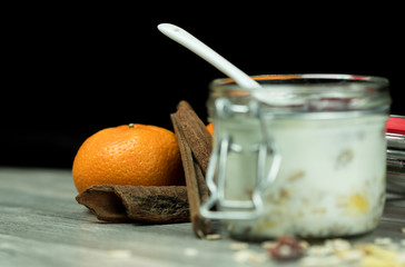 Cereal and Yogurt based breakfast in a jar shot against a black background