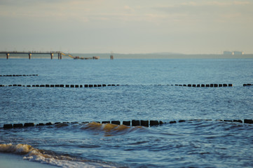 Breakwaters in the Baltic sea over the sunset