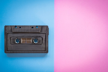 Fototapeta premium cassette tape over paper background, top view