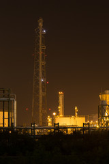Oil refinery industrial plant at night