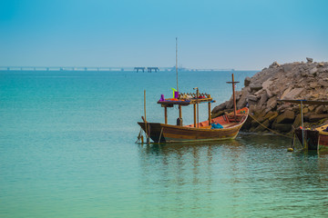 Naklejka na ściany i meble sea and Thai fishing boat with blue sky
