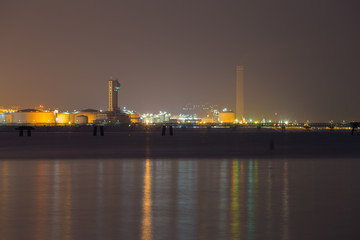 Fototapeta premium electrical power plant near sea coat at night, Rayong, Thailand